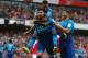 Arsenal's French striker Olivier Giroud celebrates with Arsenal's English midfielder Theo Walcott (up) and Arsenal's German-born Bosnian defender Sead Kolasinac (R) after scoring their fouth goal during the pre-season friendly football match between Arsenal and Benfica at The Emirates Stadium in north London on July 29, 2017, the game is one of four matches played over two days for the Emirates Cup. / AFP PHOTO / Ian KINGTON / RESTRICTED TO EDITORIAL USE. No use with unauthorized audio, video, data, fixture lists, club/league logos or 'live' services. Online in-match use limited to 75 images, no video emulation. No use in betting, games or single club/league/player publications. / (Photo credit should read IAN KINGTON/AFP/Getty Images)