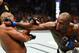 ANAHEIM, CA - JULY 29: (R-L) Jon Jones punches Daniel Cormier in their UFC light heavyweight championship bout during the UFC 214 event at Honda Center on July 29, 2017 in Anaheim, California. (Photo by Josh Hedges/Zuffa LLC/Zuffa LLC via Getty Images)