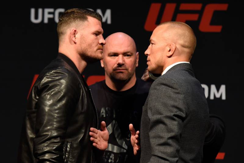 LAS VEGAS, NV - MARCH 03: (L-R) UFC middleweight champion Michael Bisping of England faces off against Georges St-Pierre of Canada during the UFC press conference at T-Mobile arena on March 3, 2017 in Las Vegas, Nevada. (Photo by Josh Hedges/Zuffa LLC/Zuffa LLC via Getty Images)