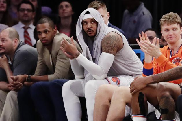 New York Knicks' Carmelo Anthony, center, watches during the second half of an NBA basketball game against the Philadelphia 76ers Wednesday, April 12, 2017, in New York. The Knicks won 114-113. (AP Photo/Frank Franklin II)
