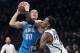Orlando Magic forward Aaron Gordon (00) goes to the basket against Brooklyn Nets forward Rondae Hollis-Jefferson during the first half of an NBA basketball game, Saturday, April 1, 2017, in New York. (AP Photo/Mary Altaffer)