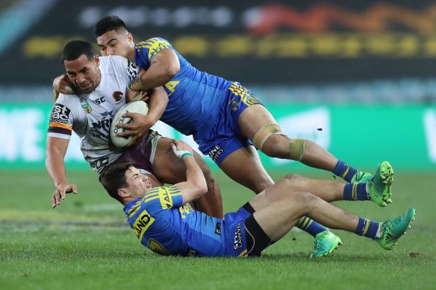 SYDNEY, AUSTRALIA - JULY 28: Tautau Moga of the Broncos is tackled during the round 21 NRL match between the Parramatta Eels and the Brisbane Broncos at ANZ Stadium on July 28, 2017 in Sydney, Australia. (Photo by Mark Metcalfe/Getty Images)