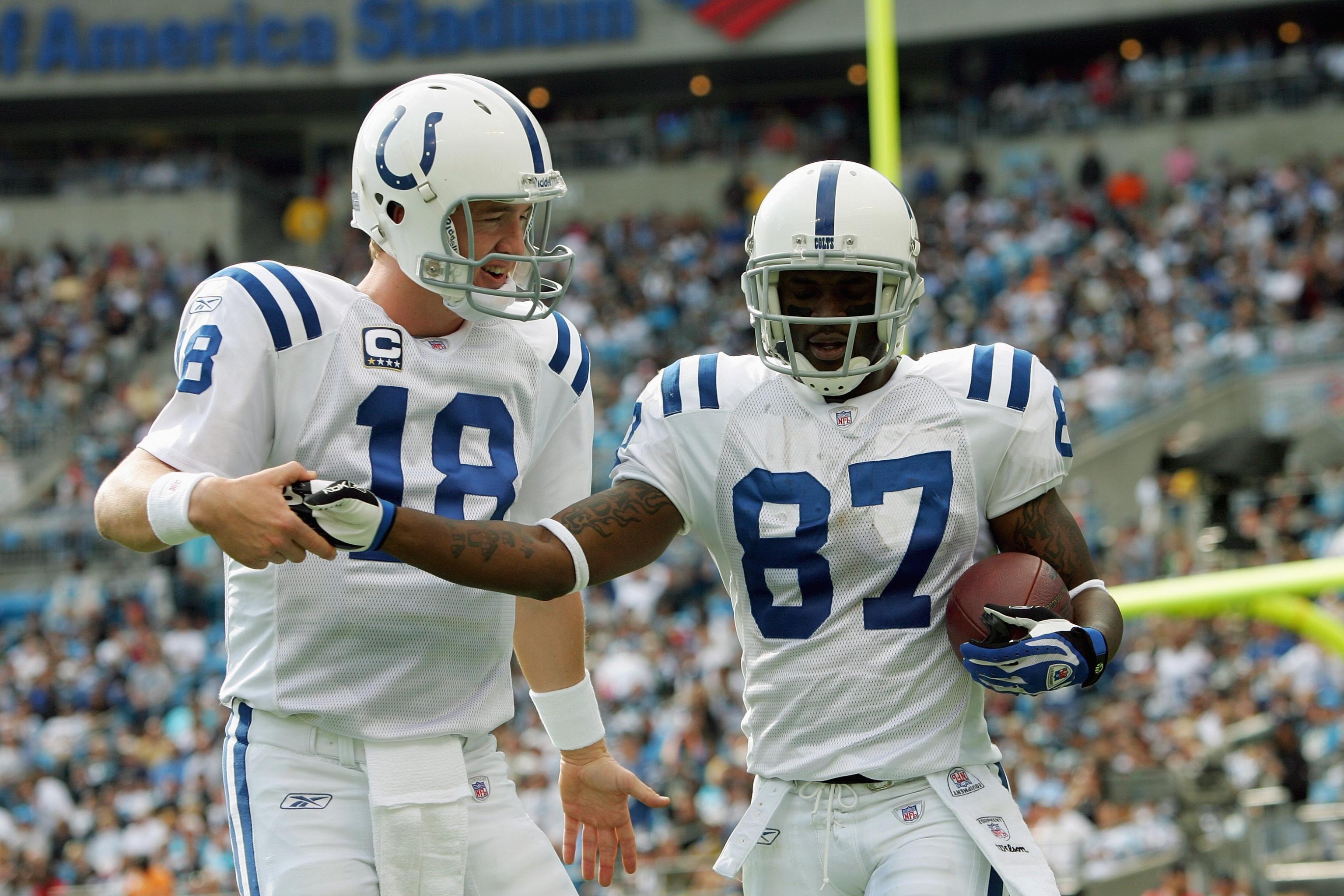 Colts legends Peyton Manning & Reggie Wayne await the announcement