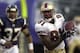 FILE - In this Sunday Nov. 17, 2002 file photo, San Francisco 49ers' Terrell Owens out runs San Diego Chargers safety Rodney Harrison with a 76 yard touchdown pass in the third quarter of an NFL football game in San Diego. (AP Photo/Denis Poroy, File)