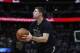 Brooklyn Nets forward Joe Harris (12) in the second half of an NBA basketball game Friday, Feb. 24, 2017, in Denver. The Nuggets won 129-109. (AP Photo/David Zalubowski)