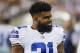 Dallas Cowboys running back Ezekiel Elliott (21) smiles on the sideling during the first half of the Pro Football Hall of Fame NFL preseason game against the Arizona Cardinals in Canton, Ohio, Thursday, Aug. 3, 2017. (AP Photo/Ron Schwane)