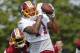Washington Redskins wide receiver Terrelle Pryor (11) hauls in a pass in front of cornerback Josh Norman (24) during practice at the Washington Redskins NFL training camp in Richmond, Va., Tuesday, Aug. 1, 2017. (AP Photo/Steve Helber)