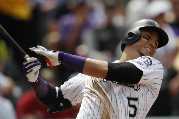 Colorado Rockies' Carlos Gonzalez swings and misses at a pitch from Philadelphia Phillies starting pitcher Aaron Nola in the sixth inning of a baseball game, Sunday, Aug. 6, 2017, in Denver. The Phillies won 3-2. (AP Photo/David Zalubowski)