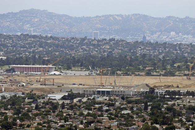 The site of construction of the new Los Angeles Rams and Chargers stadium, Los Angeles Stadium at Hollywood Park, with the Forum in the background in Inglewood, Calif., is seen in this aerial photo taken Thursday, May 25, 2017. (AP Photo/Reed Saxon)