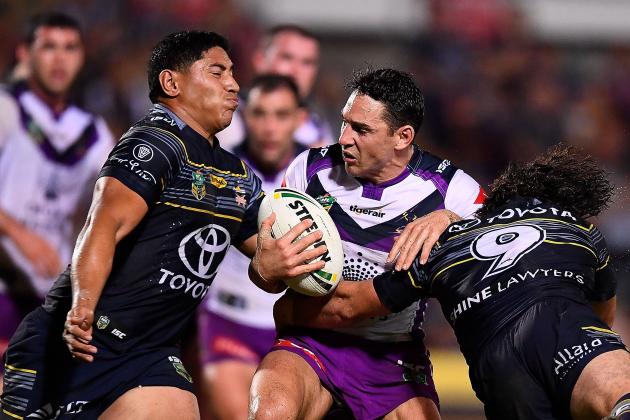 TOWNSVILLE, AUSTRALIA - AUGUST 04: Billy Slater of the Storm is tackled by Jason Taumalolo and Jake Granville of the Cowboys during the round 22 NRL match between the North Queensland Cowboys and the Melbourne Storm at 1300SMILES Stadium on August 4, 2017 in Townsville, Australia. (Photo by Ian Hitchcock/Getty Images)