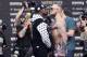 This July 13, 2017 photo shows Floyd Mayweather Jr., left, and Conor McGregor, of Ireland, facing each other for photos during a news conference at Barclays Center in New York. So far fans aren't exactly storming the box office to buy tickets for Mayweather Jr.'s fight next month with McGregor. A check online Saturday, July 29, 2017 revealed hundreds _ even thousands _ of seats still available from Ticketmaster at the T-Mobile arena for the Aug. 26 fight. There are so many open seats that fans with enough room left on their credit cards can buy six tickets together in 162 different spots throughout the arena. (AP Photo/Frank Franklin II)
