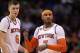 PHOENIX, AZ - DECEMBER 13: Kristaps Porzingis #6 and Carmelo Anthony #7 of the New York Knicks reacts during the second half of the NBA game against the Phoenix Suns at Talking Stick Resort Arena on December 13, 2016 in Phoenix, Arizona. The Suns defeated the Knicks 113-111 in overtime. NOTE TO USER: User expressly acknowledges and agrees that, by downloading and or using this photograph, User is consenting to the terms and conditions of the Getty Images License Agreement. (Photo by Christian Petersen/Getty Images)