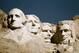 FILE - In this undated file photo, Mount Rushmore is shown in South Dakota. From left are George Washington, Thomas Jefferson, Teddy Roosevelt and Abraham Lincoln. The Partners in Preservation Campaign is asking the public to vote on 20 historic sites, including one at Mount Rushmore, that are vying for $2 million in preservation funding. The project at Mount Rushmore seeks $250,000 to restore structural elements of the Borglum View Terrace, where Rushmore sculptor Gutzon Borglum's original studio stood. (AP Photo, File)