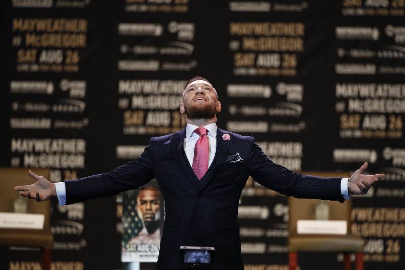 Conor McGregor gestures during a news conference at Staples Center Tuesday, July 11, 2017, in Los Angeles. McGregor is scheduled to fight Floyd Mayweather Jr. in a boxing match in Las Vegas on Aug. 26. (AP Photo/Jae C. Hong)