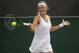 Victoria Azarenka of Belarus returns to Romania's Simona Halep during their Women's Singles Match on day seven at the Wimbledon Tennis Championships in London Monday, July 10, 2017. (AP Photo/Alastair Grant)
