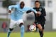REYKJAVIK, ICELAND - AUGUST 04: Eliaquim Mangala of Manchester City and Javier Hernandez of West Ham United battle for possession during a Pre Season Friendly between Manchester City and West Ham United at the Laugardalsvollur stadium on August 4, 2017 in Reykjavik, Iceland. (Photo by Ian Walton/Getty Images)
