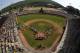 FILE - In this Aug. 28, 2016, file photo, taken with a fisheye lens, South Korea lines the third baseline and Endwell, N.Y. lines the first baseline during team introductions before the Little League World Series Championship baseball game at Lamade Stadium in South Williamsport, Pa. Little League International announced mandatory criminal background checks for its volunteer coaches, new eligibility requirements for players and a host of new rules on Wednesday, Jan. 4, 2017, intended to increase the pace of play. (AP Photo/Gene J. Puskar, File)