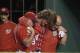 Washington Nationals' Bryce Harper, center, is helped in the dugout after he was injured during the first inning of the team's baseball game against the San Francisco Giants, Saturday, Aug. 12, 2017, in Washington. (AP Photo/Nick Wass)