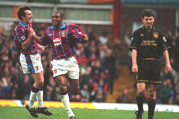 6 NOV 1994:  RAY HOUGHTON AND DALIAN ATKINSON OF ASTON VILLA CELEBRATE ATKINSONS GOAL AGAINST MANCHESTER UNITED DURING THE ENGLISH PREMIER LEAGUE MATCH AT VILLA PARK, BIRMINGHAM.  AT RIGHT, DENNIS IRWIN OF MANCHESTER UNITED. Mandatory Credit: David Rogers/ALLSPORT