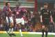 6 NOV 1994: RAY HOUGHTON AND DALIAN ATKINSON OF ASTON VILLA CELEBRATE ATKINSONS GOAL AGAINST MANCHESTER UNITED DURING THE ENGLISH PREMIER LEAGUE MATCH AT VILLA PARK, BIRMINGHAM. AT RIGHT, DENNIS IRWIN OF MANCHESTER UNITED. Mandatory Credit: David Rogers/ALLSPORT