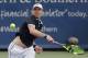 Sam Querrey returns to Stefan Kozlov during the first round at the Western & Southern Open tennis tournament, Monday, Aug. 14, 2017, in Mason, Ohio. (AP Photo/John Minchillo)