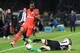Angers' French midfielder Baptiste Santamaria (R) vies with Paris Saint-Germain's Ivorian defender Serge Aurier during the French L1 football match Angers against Paris Saint-Germain (PSG) on April 14, 2017 at the Raymond Kopa stadium in Angers, western of France. / AFP PHOTO / FRED TANNEAU (Photo credit should read FRED TANNEAU/AFP/Getty Images)