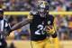 PITTSBURGH, PA - JANUARY 08: Le'Veon Bell #26 of the Pittsburgh Steelers carries the ball during the third quarter against the Miami Dolphins in the AFC Wild Card game at Heinz Field on January 8, 2017 in Pittsburgh, Pennsylvania. (Photo by Rob Carr/Getty Images)