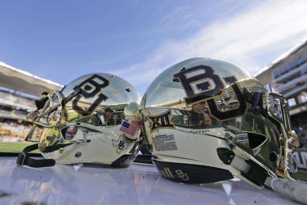 FILE - In this Dec. 5, 2015, file photo, Baylor helmets on shown the field after an NCAA college football game in Waco, Texas. The NCAA board of governors has adopted a policy that requires sexual violence education for all college athletes, coaches and athletics administrators. Campus leaders such as athletic directors and school presidents will be required to attest that athletes, coaches and administrators have been educated on sexual violence each year. The move follows a number of high-profile assault cases, including Baylor. (AP Photo/LM Otero, File)