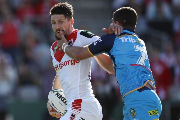 SYDNEY, AUSTRALIA - AUGUST 12: Gareth Widdop of the Dragons is tackled by Ashley Taylor of the Titans during the round 23 NRL match between the St George Illawarra Dragons and the Gold Coast Titans at UOW Jubilee Oval on August 12, 2017 in Sydney, Australia. (Photo by Mark Kolbe/Getty Images)