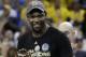 Golden State Warriors forward Kevin Durant smiles as he holds the Bill Russell NBA Finals Most Valuable Player Award after Game 5 of basketball's NBA Finals between the Warriors and the Cleveland Cavaliers in Oakland, Calif., Monday, June 12, 2017. The Warriors won 129-120 to win the NBA championship. (AP Photo/Marcio Jose Sanchez)