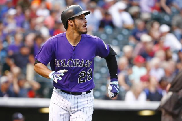Colorado Rockies' Nolan Arenado looks at the flight of a solo home run ball hit against Atlanta Braves starting pitcher Sean Newcomb during the first inning of a baseball game Tuesday, Aug. 15, 2017, in Denver. (AP Photo/Jack Dempsey)