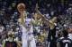 Los Angeles Lakers' Lonzo Ball shoots over Los Angeles Clippers' Brice Johnson (10) during overtime of an NBA summer league basketball game, Friday, July 7, 2017, in Las Vegas. (AP Photo/John Locher)