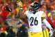 KANSAS CITY, MP - JANUARY 15: Running back Le'Veon Bell #26 of the Pittsburgh Steelers tosses the ball forward after gaining a first down against the Kansas City Chiefs during the first quarter in the AFC Divisional Playoff game at Arrowhead Stadium on January 15, 2017 in Kansas City, Missouri. (Photo by Dilip Vishwanat/Getty Images)