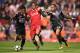 Liverpool's Dutch midfielder Georginio Wijnaldum (C) vies with Crystal Palace's English midfielder Jason Puncheon (R) and Crystal Palace's Dutch defender Patrick van Aanholt (L) during the English Premier League football match between Liverpool and Crystal Palace at Anfield in Liverpool, north west England on August 19, 2017. / AFP PHOTO / Oli SCARFF / RESTRICTED TO EDITORIAL USE. No use with unauthorized audio, video, data, fixture lists, club/league logos or 'live' services. Online in-match use limited to 75 images, no video emulation. No use in betting, games or single club/league/player publications. / (Photo credit should read OLI SCARFF/AFP/Getty Images)
