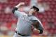 Miami Marlins starting pitcher throws against the Cincinnati Reds during the first inning of a baseball game, Sunday, July 23, 2017, in Cincinnati. (AP Photo/Gary Landers)