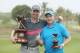 SUVA, FIJI - AUGUST 20: Jason Norris of Australia poses with his caddie Shannon Aistrope and the trophy after winning on day four of the 2017 Fiji International at Natadola Bay Championship Golf Course on August 20, 2017 in Suva, Fiji. (Photo by Mark Metcalfe/Getty Images)