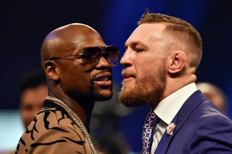 Jul 14, 2017; London, United Kingdom; Conor McGregor and Floyd Mayweather face off during a world tour press conference to promote the upcoming Mayweather vs McGregor boxing fight at SSE Arena. Mandatory Credit: Steve Flynn-USA TODAY Sports