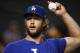 Los Angeles Dodgers' Clayton Kershaw tosses the baseball prior to a baseball game against the Arizona Diamondbacks Thursday, Aug 10, 2017, in Phoenix. The Dodgers defeated the Diamondbacks 8-6. (AP Photo/Ross D. Franklin)