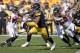 Pittsburgh Steelers running back James Conner (30) runs the ball as Atlanta Falcons defensive end Brooks Reed (50) and outside linebacker Duke Riley (42) defend in the first half of an NFL preseason football game, Sunday, Aug. 20, 2017, in Pittsburgh. (AP Photo/Fred Vuich)