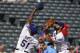 Texas Rangers relief pitcher Matt Bush (51) goes to catch an infield fly ball in front of third baseman Joey Gallo (13) in the eighth inning of a baseball game, Sunday, Aug. 20, 2017, in Arlington, Texas. The play resulted in a collision that caused both players to leave the game. (AP Photo/ Richard W. Rodriguez)