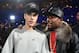 LOS ANGELES, CA - NOVEMBER 13: Singer/songwriter Justin Bieber (L) and professional boxer Floyd Mayweather Jr. walk backstage during An Evening With Justin Bieber at Staples Center on November 13, 2015 in Los Angeles, California. (Photo by Jason Merritt/Getty Images for Universal Music)