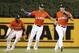 Miami Marlins center fielder Christian Yelich, right, right fielder Giancarlo Stanton, center, and left fielder Marcell Ozuna, left, celebrate after they defeated the Colorado Rockies in a baseball game, Sunday, Aug. 13, 2017, in Miami. (AP Photo/Wilfredo Lee)