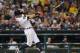 Detroit Tigers' Ian Kinsler loses his grip on his bat as it flies into the stands against the Los Angeles Dodgers in the sixth inning of a baseball game in Detroit, Friday, Aug. 18, 2017. (AP Photo/Paul Sancya)