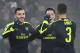 Arsenal's Spanish forward Lucas Perez (L) celebrates with his teammate Arsenal's German midfielder Mesut Ozil (2ndR) and Arsenal's English defender Kieran Gibbs after scoring a goal during the UEFA Champions league Group A football match between FC Basel 1893 and Arsenal FC on December 6, 2016 at the St Jakob Park stadium in Basel. / AFP / Patrick HERTZOG (Photo credit should read PATRICK HERTZOG/AFP/Getty Images)