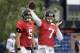 Jacksonville Jaguars quarterback Chad Henne, right, passes the ball as quarterback Blake Bortles, left, looks on during an NFL football joint practice with the New England Patriots, Monday, Aug. 7, 2017, in Foxborough, Mass. (AP Photo/Steven Senne)