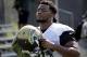 FILE- In this July 28, 2017, file photo, Jacksonville Jaguars defensive end Dante Fowler Jr., arrives at practice during NFL football training camp in Jacksonville, Fla. Fowler is determined to alter his image and change his reputation. Fowler was arrested twice in 17 months, including once in July. “From now on, when people say my name, I want them to talk about a soft-hearted, good guy,” he said. “A teddy bear off the field but a monster on the field. I don’t need to be doing the monstrous stuff off the field.” (AP Photo/John Raoux, File)