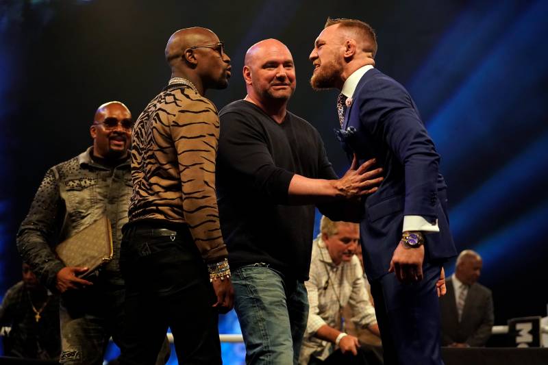 LONDON, ENGLAND - JULY 14: UFC President Dana White (C) steps between Conor McGregor (R) and Floyd Mayweather Jr. as they face off during the Floyd Mayweather Jr. v Conor McGregor World Press Tour event at SSE Arena on July 14, 2017 in London, England. (Photo by Jeff Bottari/Zuffa LLC/Zuffa LLC via Getty Images)