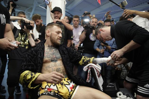 Conor McGregor has his hands wrapped before a media workout Friday, Aug. 11, 2017, in Las Vegas. McGregor is scheduled to fight Floyd Mayweather Jr. in a boxing match Aug. 26 in Las Vegas. (AP Photo/John Locher)