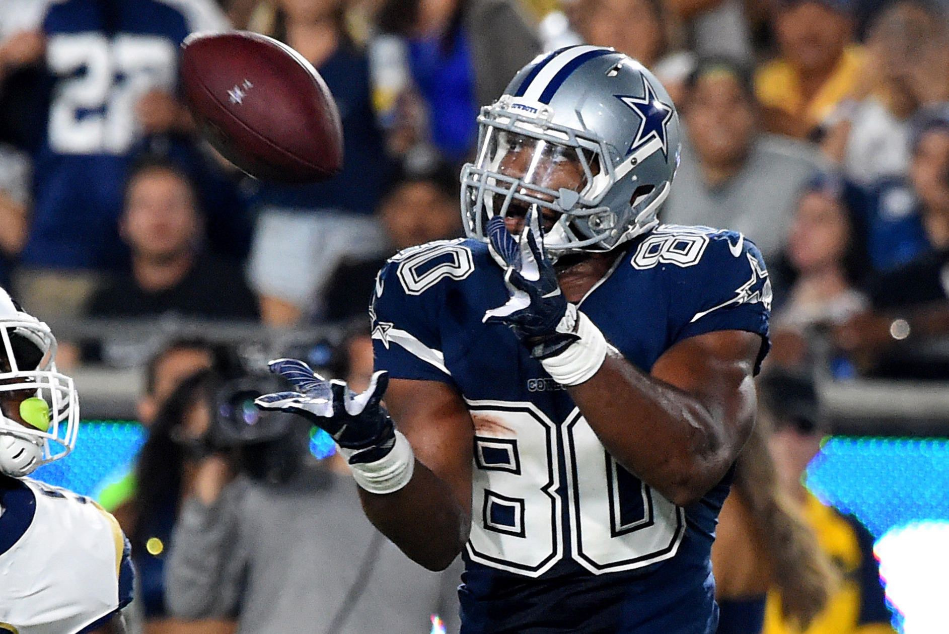 Cowboys' Rico Gathers trying football