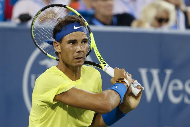 Rafael Nadal, of Spain, returns to Nick Kyrgios, of Australia, at the Western & Southern Open tennis tournament, Friday, Aug. 18, 2017, in Mason, Ohio. (AP Photo/John Minchillo)